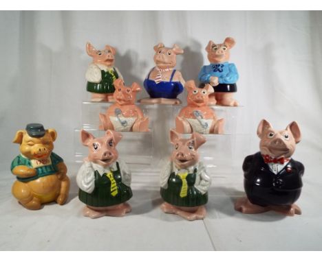 A sounder of eight collectable ceramic NatWest Pigs each with NatWest stoppers to the base, and one other 