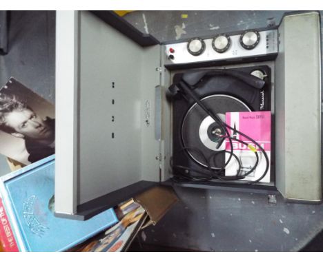 A Bush portable record player model No.SRP41 together with a collection of approximately 43 records to include The Carpenters