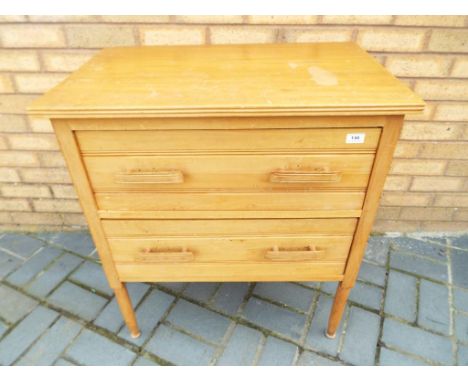 A light wood chest of two drawers, approx 81 cm x 72 cm x 46 cm