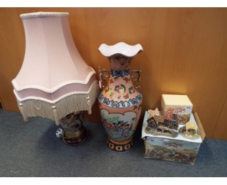Lot to include a large oriental vase, table lamp with shade and two boxed David Winter cottages. (4)