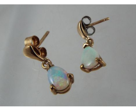 A pair of 9 carat gold opal set earrings stamped 375. Estimate £30 - £50