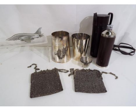 A lot to include leather cased hip flask, white metal model of a fighter jet, two white metal evening purses and plated ware