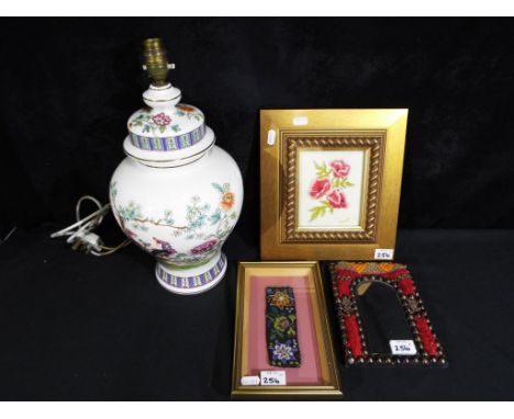 A ceramic table lamp decorated with floral pattern, approximate height 42 cm and a micro beaded tapestry framed under glass, 