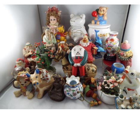 A good mixed lot of collectable items to include ceramic Teddy bears, ceramic Father Christmas, clowns, a metal Buddha and ot