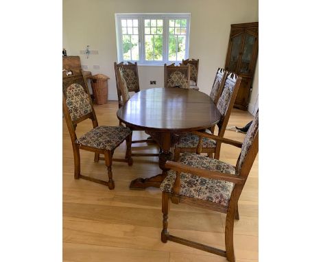 Andrena furniture - a carved light oak dining set comprising extending pedestal table 76 cm x 116 cm (diam), extended length 