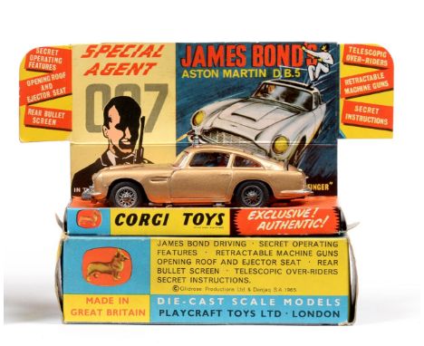 Corgi 261 James Bond Aston Martin DB5 in display box with leaflet, two men and lapel badge (E-G box G-E) 