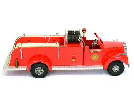 Smith Miller B-Mack Fire Pumper in Smith Miller Fire Department livery with wooden ladder, twin hose reel, cotton hose and ot