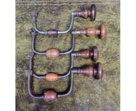 Tools:&nbsp;four 18th/19th century 'sixpenny' braces, one marked 'Selig Junior Co,' each with turned head and handle, one wit