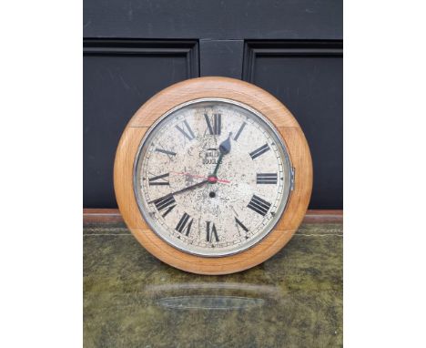 A pale oak wall clock, the circular dial inscribed 'C Wallace, Douglas', 40.5cm diameter, with later battery movement.&nbsp; 
