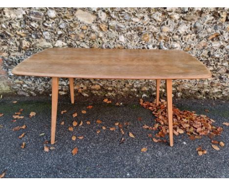 A vintage Ercol dining table,&nbsp;150cm long, (s.d. to surface). 