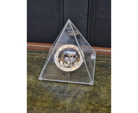 An aneroid barometer, in perspex pyramid case, 18cm high. 