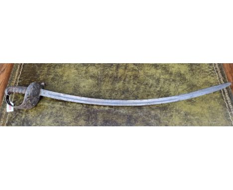 A 19th century British Indian army irregular horse trooper’s sword, by Henry Wilkinson, the 89cm curved blade etched with pan