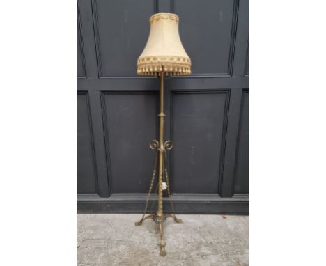 A brass tripod standard lamp, height including shade 165cm.&nbsp; 