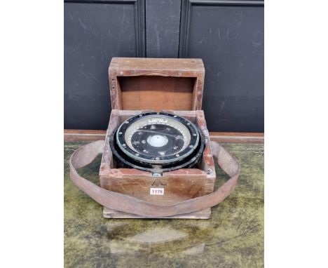 A ship's gimbal compass,&nbsp;in wood case with broad arrow stamp, 26cm wide. 