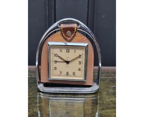 A vintage chrome and leather novelty stirrup clock, by Smiths, 14cm high. 
