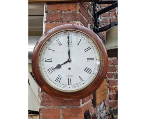 A walnut wall clock, the painted dial inscribed 'Smith, Enfield', 39.5cm diameter, with pendulum. 