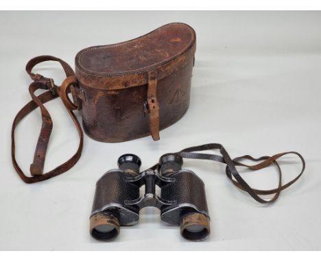 A pair of vintage binoculars, the leather case with military broad arrow stamp. 