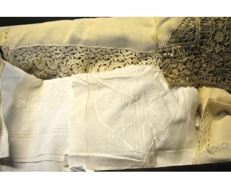 Two boxes containing a collection of laundered table linen to include; damask tablecloths and examples with embroidery, drawn