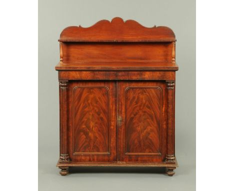 A Victorian mahogany chiffonier, with shaped pediment and shelf with turned supports above the base fitted with a shallow dra