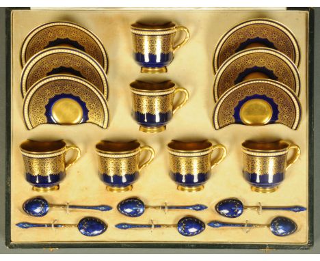 A Royal Worcester coffee service, cased, 6 cups, 6 saucers and 6 enamelled Sterling silver spoons, the case stamped "Reid & S
