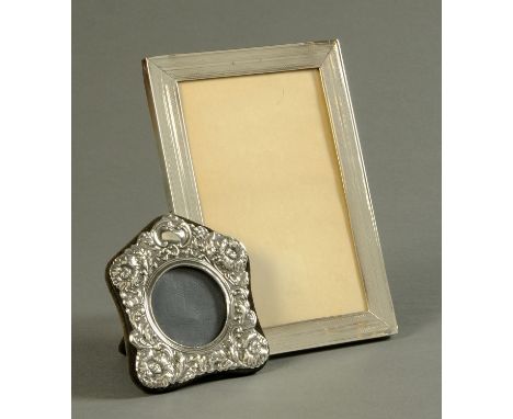 A silver photograph frame, rectangular, engine turned and with easel back, London 1913,15 cm x 21.5 cm, and another London ma