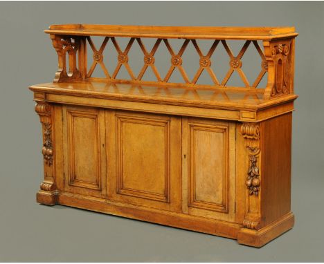 A Victorian pollard oak buffet, with three quarter gallery to the top shelf, with pierced end supports, moulded edge to the r