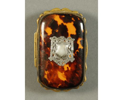 A Victorian tortoiseshell purse, shaped rectangular outline, with silver coloured metal applique and mother of pearl armorial