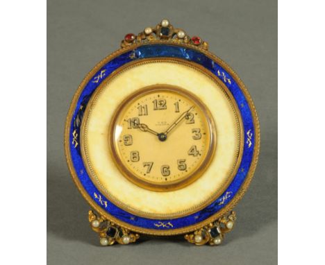 A French Duverdre blue and enamel desk clock, circa 1920, the face marked T & B, Vienna".  Diameter 97 mm.