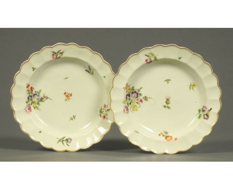 A pair of Worcester porcelain dishes with lobed edges, polychrome, decorated with floral bouquets and sprigs, third quarter 1