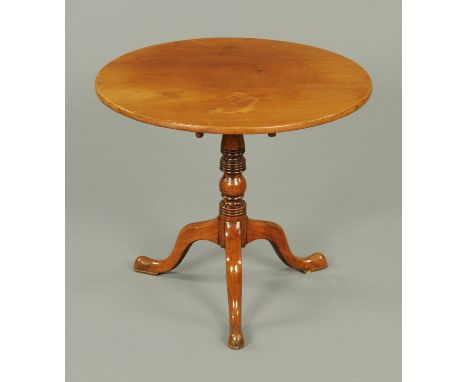 A George III mahogany tripod table, circular, with snap action, turned column and three downswept legs terminating in pad fee