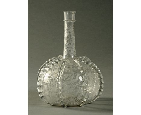 An 18th century club shaped ribbed flask, foliate engraved with peacocks and fruiting vine decoration.  Height 24 cm.  CONDIT