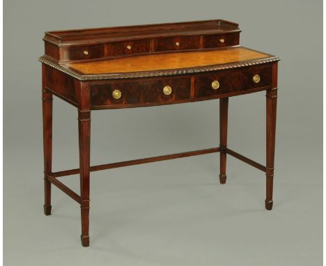 A mahogany desk, with rear superstructure fitted with shallow drawers, brown tooled leather writing surface, moulded edge, tw