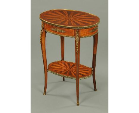 A late 19th century Continental specimen wood topped table, with frieze drawer, cabriole legs, low shelf and gilt metal mount