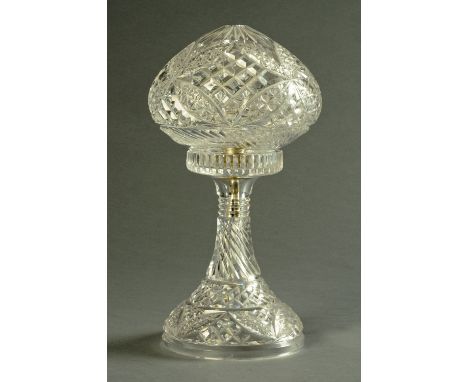 A cut glass table lamp, with mushroom shaped shade.  Shade diameter 18 cm. 