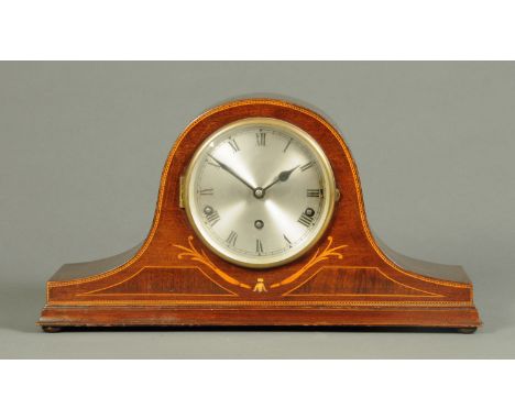 An Edwardian inlaid mahogany cased mantle clock, with three-train movement striking on five gongs.  Width 46.5 cm. 