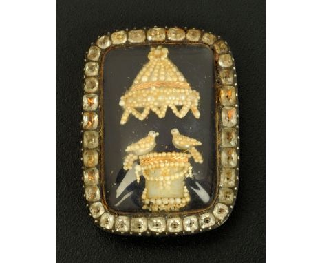A Regency gold coloured metal seed pearl and enamel brooch, inscribed "To SJT from CWS June 22nd 1897 to The Finest Lady in T
