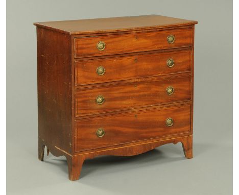 A Regency mahogany chest of drawers, with ebony stringing and with four long graduated drawers with brass drop handles, circu