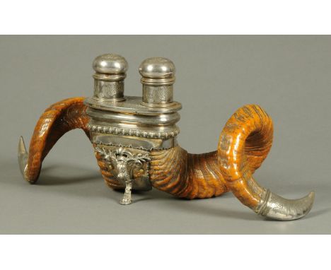 A pair of 19th century Scottish rams horns, with double silver plated inkwell mount.  Length 49 cm (see illustration).  CONDI