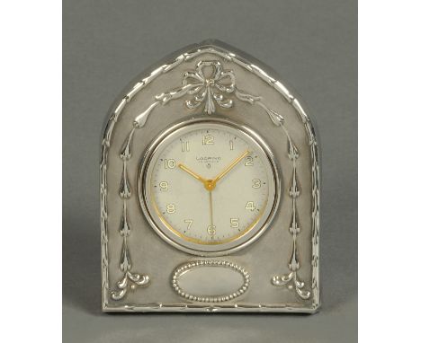 A silver cased timepiece, with easel back, Birmingham 1979, and with Looping movement with alarm.  Width 10.3 cm (see illustr