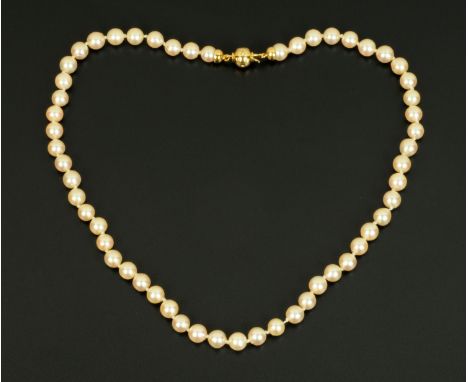 A cultured pearl necklace, with 18 ct gold and diamond set clasp.  Length 47 cm. 