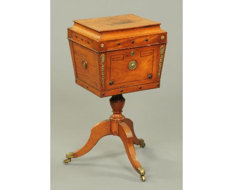 A Regency mahogany teapoy, converted to a worktable, with caddy top, ebony stringing, brass carrying handle to either side, t
