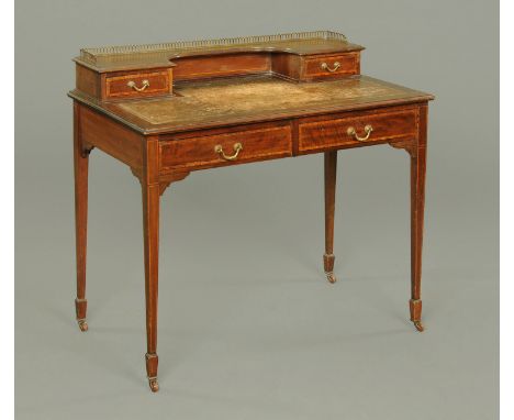 An Edwardian inlaid mahogany ladies desk, with galleried superstructure, tooled leather writing surface, fitted with two frie