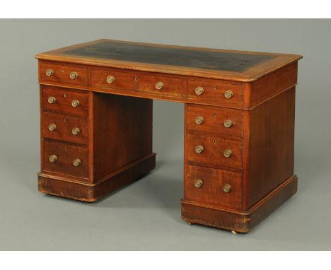 A Victorian mahogany pedestal desk, with rounded front corners, moulded edge and tooled leather writing surface, fitted with 