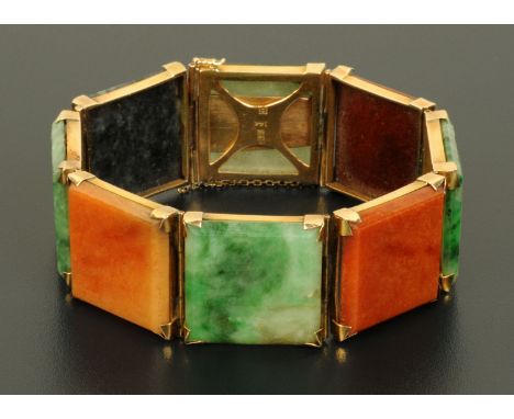 A 14 ct gold Burmese jade bracelet, eight panels, with safety chain (see illustration).   CONDITION REPORT: The bracelet appe