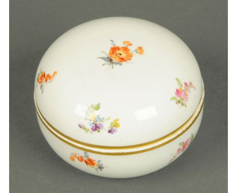  Meissen lidded trinket box, circular, polychrome, blue crossed swords mark.  Diameter 9 cm. 