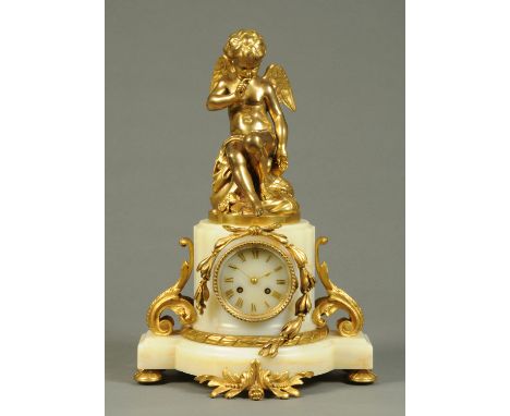 A 19th century onyx mantle clock, with winged cherub surmount, two-train striking movement and ormolu mounts.  Width 33 cm, h