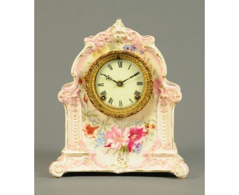 A late 19th century German mantle clock, with painted earthenware case and with two-train striking movement.  Height 32 cm. 