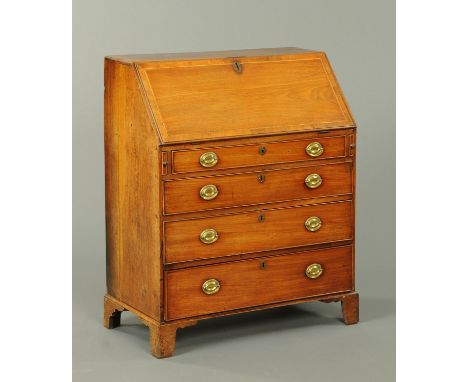A George III mahogany bureau, the slope front with crossbanded moulded and boxwood strung edge opening to a fitted interior a