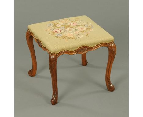A Continental walnut stool, raised on four cabriole legs and with foliate tapestry top.  Width 49 cm. 
