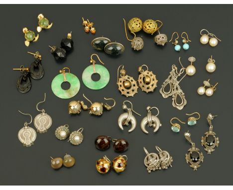 A bag of jade earrings, and metal and stone earrings.